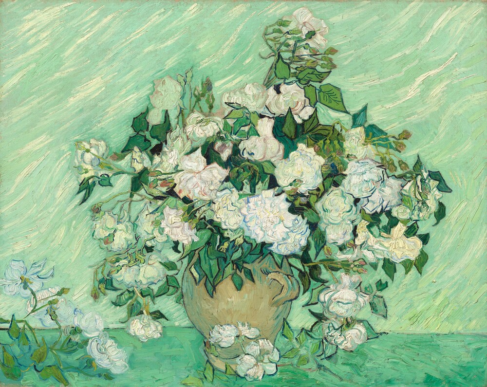 White roses and green leaves against a pale green background.